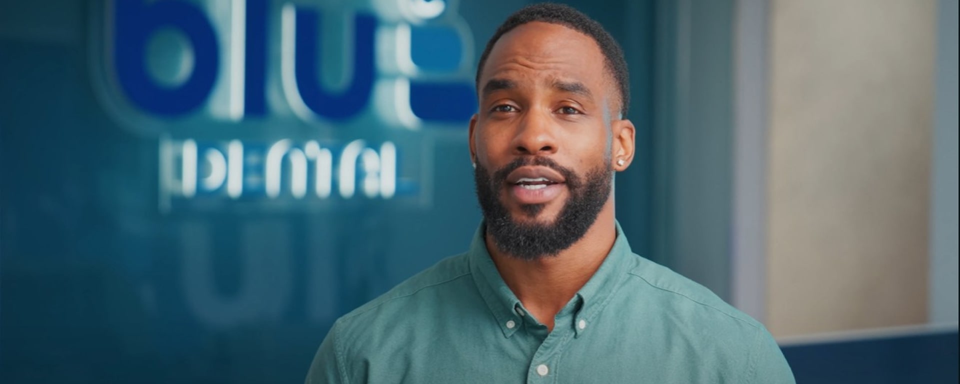 A man is smiling while giving his testimonials about Blu Dental dentistry