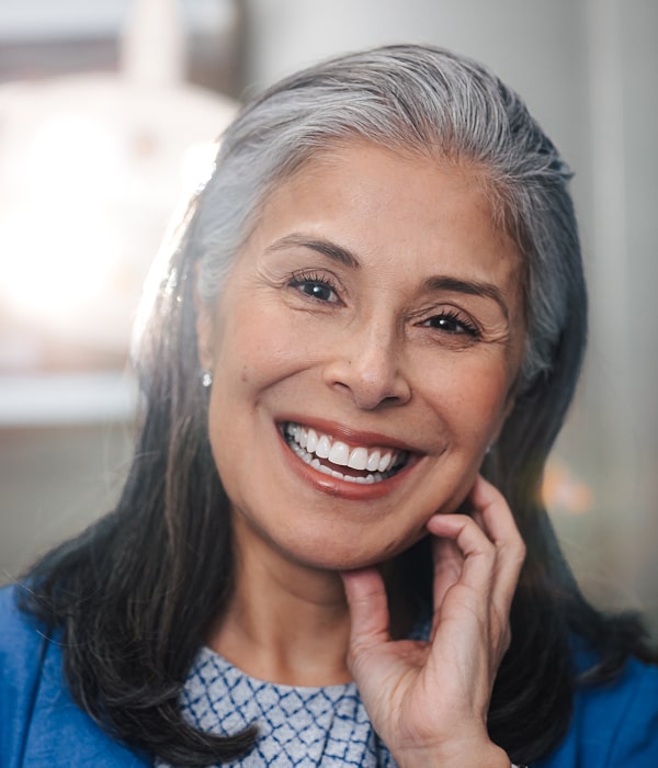 Your Dream Smile Starts Here – Customized Just for You. A woman is smiling