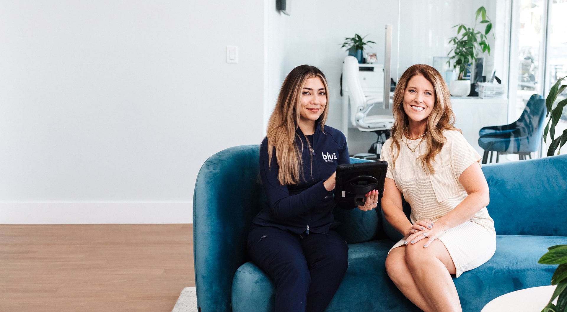 Blu Dental professional smiling with a happy patient