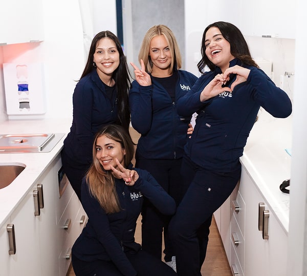 Oral Care Elite: Premium Dental Plans, Made Simple. Blu Dental team having fun at the office