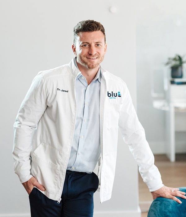 Try a Virtual Consultation from Home. Dentist is smiling
