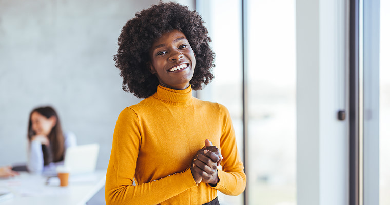 A woman smiling in an office