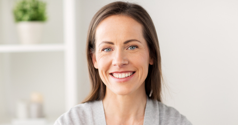 An older woman smiling happily