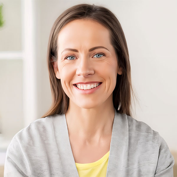 A curly woman smiling